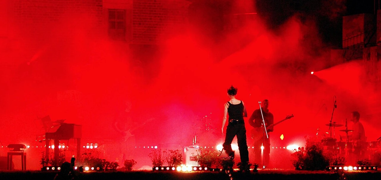 Maria Peszek on stage in red light during a performance in 2008