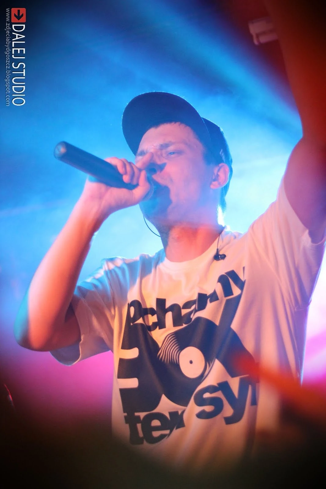 Bisz performing with a microphone