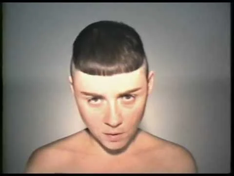 Portrait of Maria Peszek in a music-video still