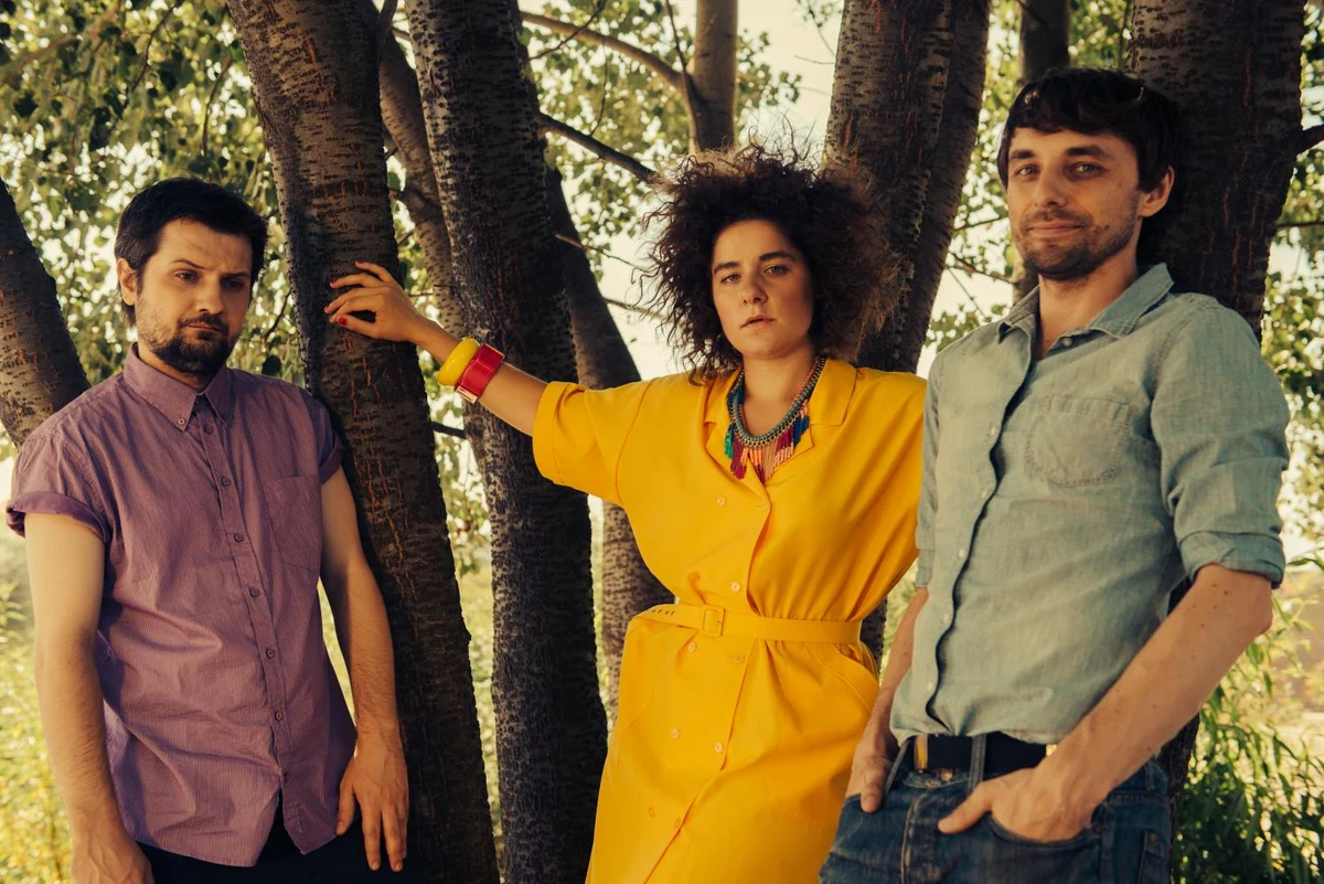 Pustki trio pictured among trees