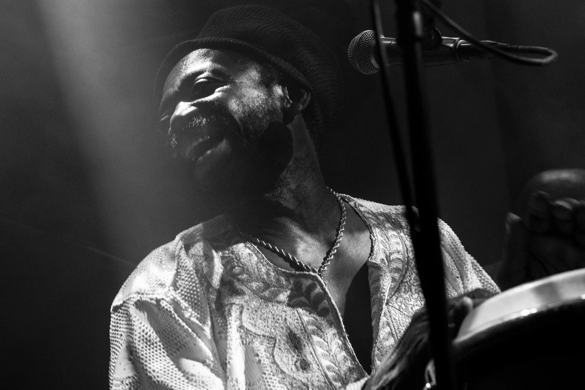 African Head Charge founder Bonjo Iyabinghi Noah at a microphone
