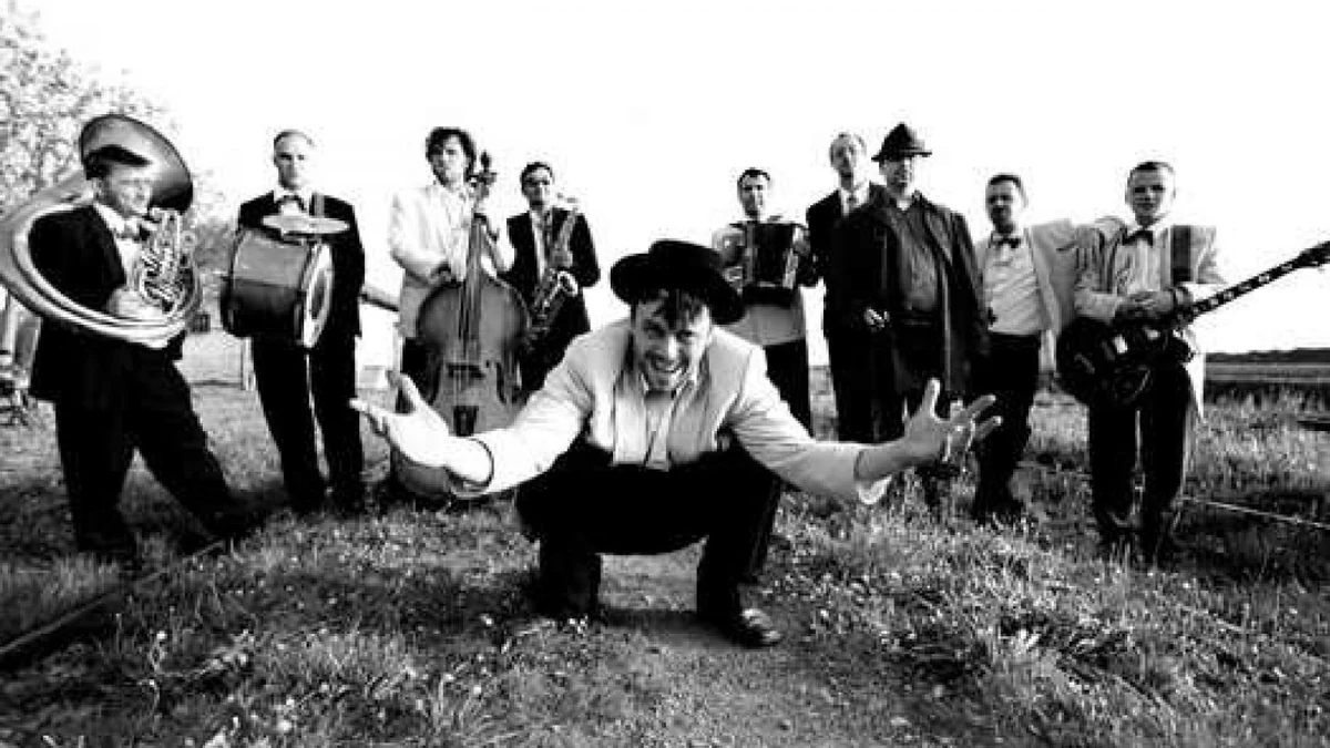 Emir Kusturica and The No Smoking Orchestra in a black-and-white photograph